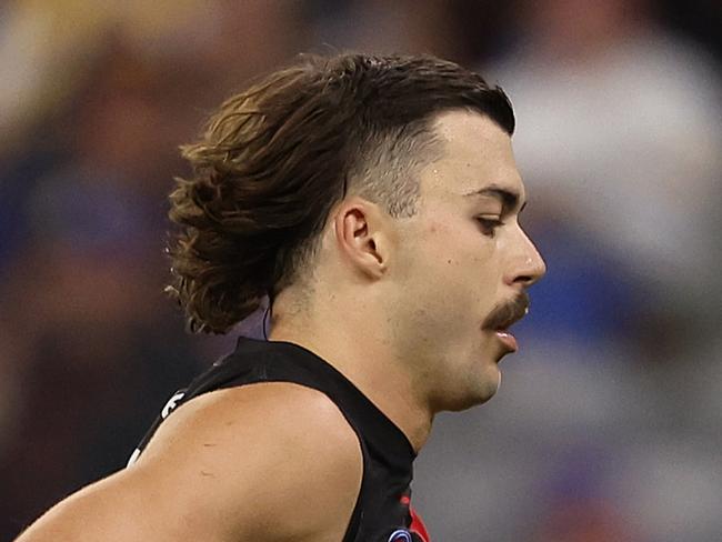 PERTH, AUSTRALIA - APRIL 18: Sam Draper of the Bombers comes from the ground with a leg injury during the round six AFL match between West Coast Eagles and Essendon Bombers at Optus Stadium, on April 18, 2025, in Perth, Australia. (Photo by Paul Kane/Getty Images)