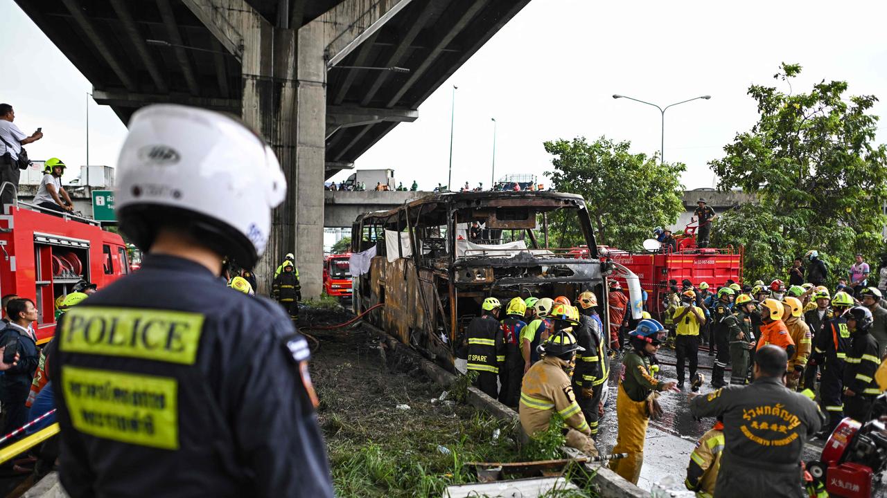 The bus crashed after a tyre burst, igniting its compressed gas fuel tanks, according to rescue workers. (Photo by Manan VATSYAYANA / AFP)