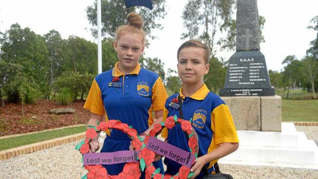 Maddison Jaggers McPhee and Riley Bloomfield at the Stenhouse Park monument. Picture: Jann Houley