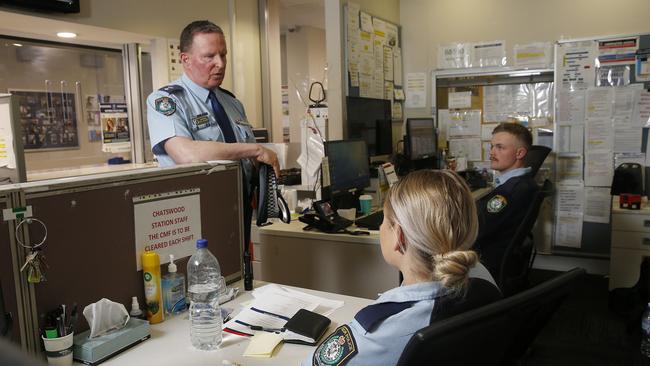 Superintendent Devaney speaks with Constables Jemma Allan and Oliver Thompson in Chatswood Police station. Picture: John Appleyard