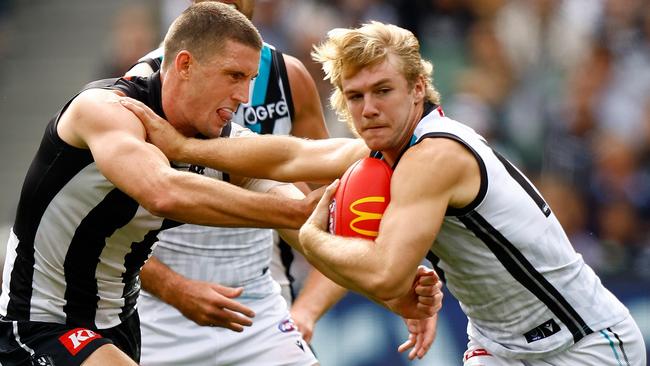 MELBOURNE, AUSTRALIA - MARCH 25: Jason Horne-Francis of the Power fends off Darcy Cameron of the Magpies during the 2023 AFL Round 02 match between the Collingwood Magpies and the Port Adelaide Power at the Melbourne Cricket Ground on March 25, 2023 in Melbourne, Australia. (Photo by Michael Willson/AFL Photos via Getty Images)