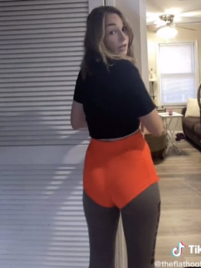 Hooters bartender Kristen Songer, 22, showed off the old orange uniform shorts that have been replaced as of October 4. Picture: TikTok