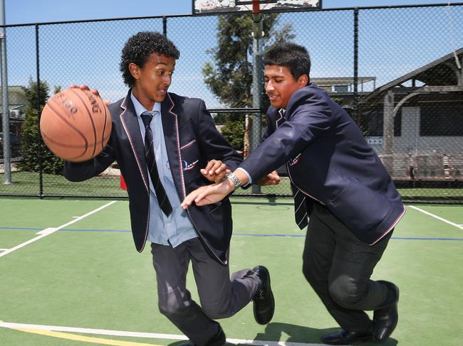 Al-Taqwa College students Wajdaan Malik, 15, and Ibrahim Khalifa, 16, keep busy playing basketball during the their lunch break. Picture: David Caird