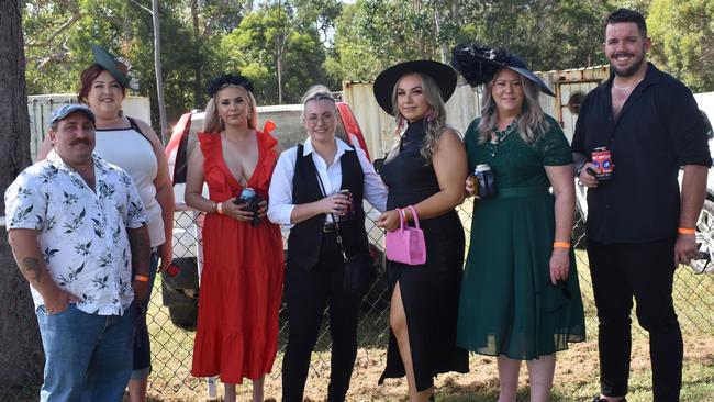 Nate Alexander, Ash Cahill, Kayea Morgan, Brooke Kennan, Jessica Keenan, Tiffany Messer and Stan Jasper at the Yeppoon race day at Keppel Park racecourse on April 26, 2025.