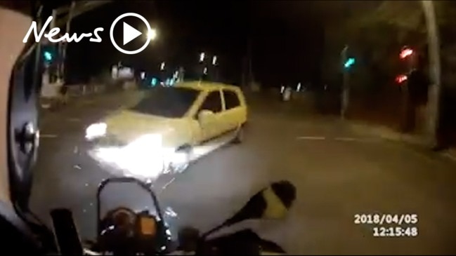 Dashcam footage shows motorbike rider hit by car