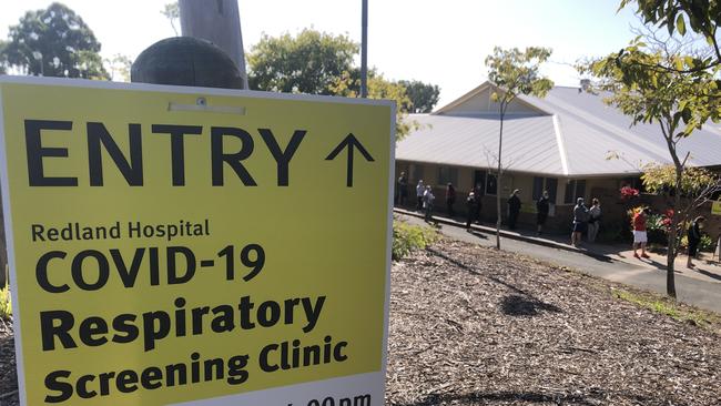 People waiting in line to be screened for COVID-19 at Redland Hospital this morning.