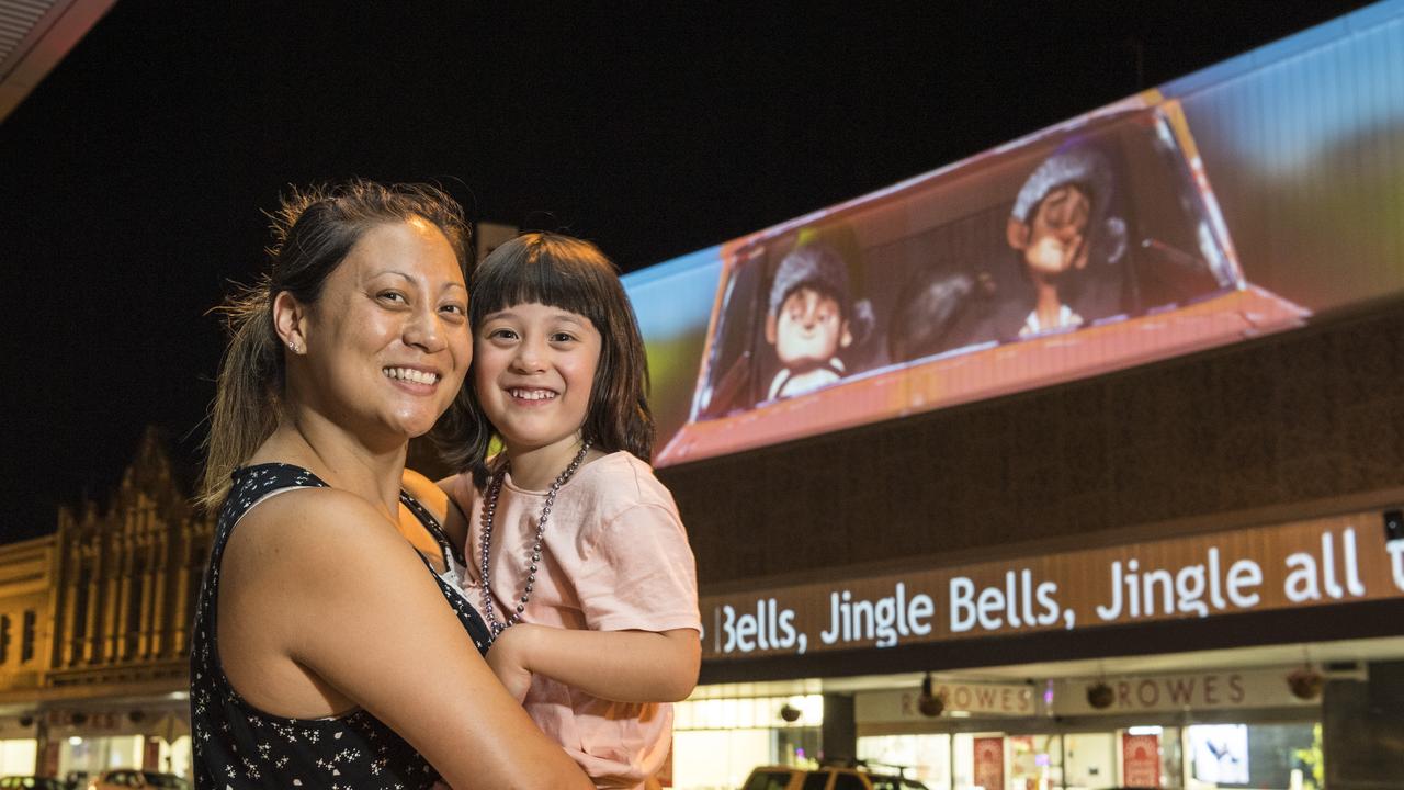 Four-year-old Lilo Gordon and mum Taarna Gordon admire the Rowes projection, Saturday, December 5, 2020. Picture: Kevin Farmer