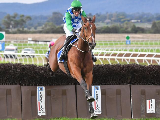 Stern Idol (IRE) ridden by William McCarthy clears a steeple on the way to winning the J.E.H Spencer Memorial Steeplechase at Sportsbet Pakenham on April 14, 2024 in Pakenham, Australia. (Photo by Pat Scala/Racing Photos via Getty Images)