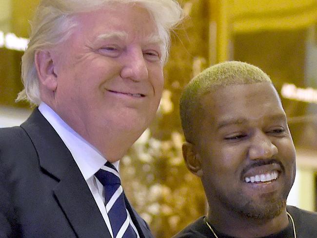 Singer Kanye West and President-elect Donald Trump arrive to speak with the press after their meetings at Trump Tower December 13, 2016 in New York. / AFP PHOTO / TIMOTHY A. CLARY