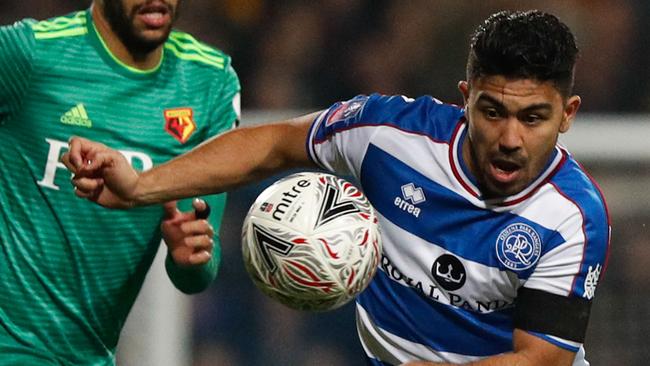 Queens Park Rangers' Australian midfielder Massimo Luongo (R) chases the ball down in the eye of Watford's French midfielder Etienne Capoue (L) during the English FA Cup fift round football match between Queens Park Rangers and Watford at Loftus Road Stadium in London on February 15, 2019. (Photo by Adrian DENNIS / AFP) / RESTRICTED TO EDITORIAL USE. No use with unauthorized audio, video, data, fixture lists, club/league logos or 'live' services. Online in-match use limited to 120 images. An additional 40 images may be used in extra time. No video emulation. Social media in-match use limited to 120 images. An additional 40 images may be used in extra time. No use in betting publications, games or single club/league/player publications. /