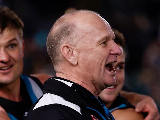 ADELAIDE, AUSTRALIA - SEPTEMBER 13: Ken Hinkley, Senior Coach of the Power exchanges words with Hawthorn players after the 2024 AFL Second Semi Final match between the Port Adelaide Power and the Hawthorn Hawks at Adelaide Oval on September 13, 2024 in Adelaide, Australia. (Photo by Michael Willson/AFL Photos via Getty Images)