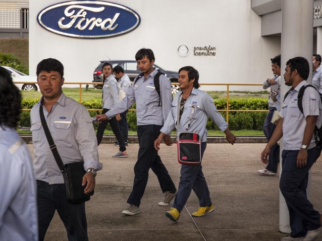 THAILAND 28 September 2016 .. Ford workers leave the manufacturing plant, outside of Bangkok, after their shift. Picture: Patrick Brown