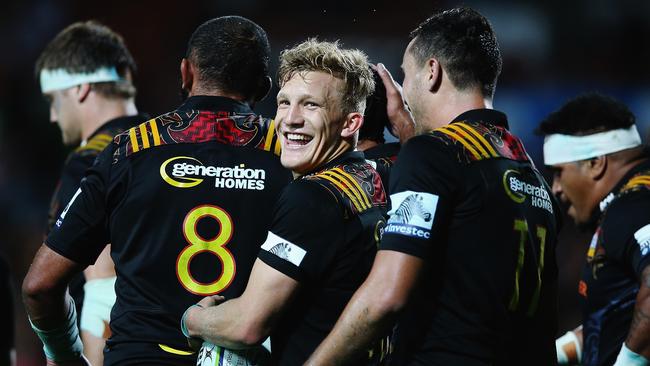 Damian McKenzie of the Chiefs celebrates after beating the Force.