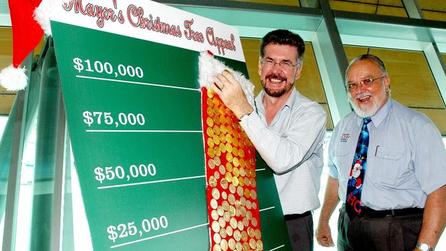 Townsville Mayor Tony Mooney and Cr Dale Parker complete the tally for this year's Mayor's Christmas Tree Appeal. The Appeal raised $190,000 in cash, food and gift donations for those in need this Christmas.