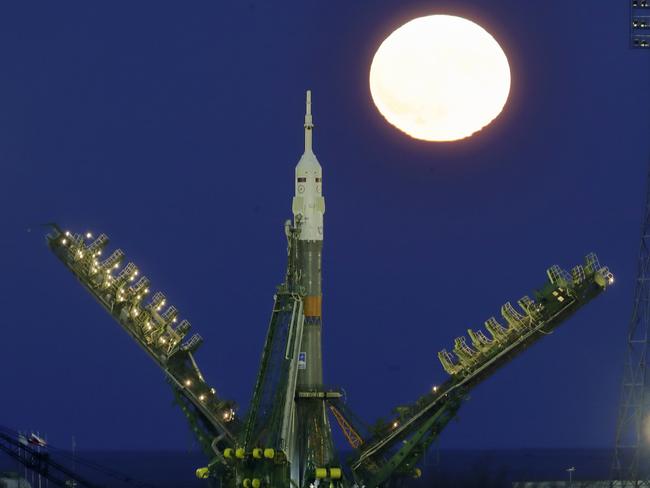 The super moon rises over Russia’s Soyuz-FG booster rocket with the Soyuz MS-03 space ship that will carry new crew to the International Space Station (ISS) installed at the launch pad at the Russian leased Baikonur cosmodrome, Kazakhstan, Monday, Nov. 14, 2016. Picture: AP Photo/Dmitri Lovetsky