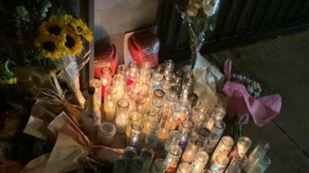 A memorial, featuring flowers, candles and a pair of boxing gloves, set up at the scene of the shooting in the Californian city. Picture: Supplied