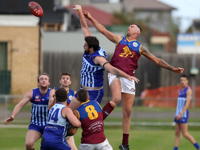 NFL: The ruckmen fly for Reservoir and South Morang. Picture: Stuart Milligan