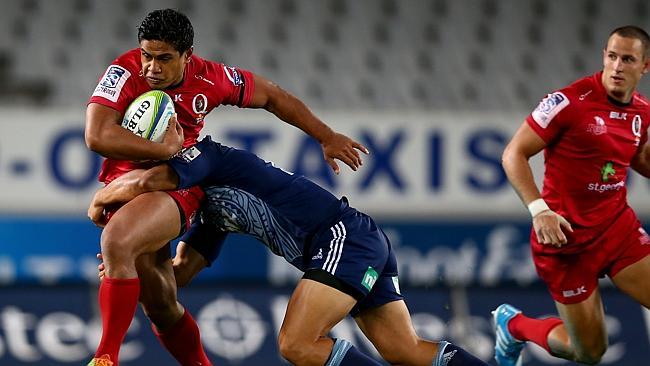 Ben Tapuai makes a charge for the Reds against the Blues at Eden Park.