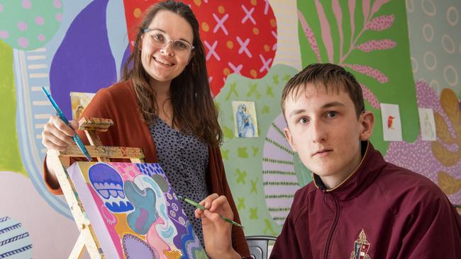 Local artist Alex Stalling shares her passion and expertise with George Storie. Deaf and hard of hearing teenagers will learn how to communicate artistically in a workshop designed to develop their creativity. Picture: Nev Madsen.