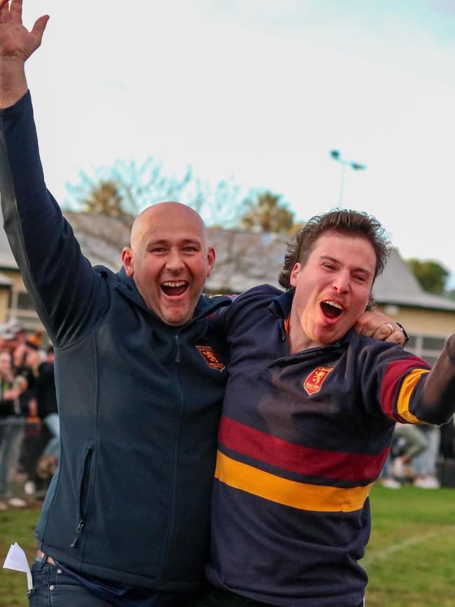 SMOSH West Lakes coach Brad Day (left) celebrates as the siren sounds. Picture: Brayden Goldspink