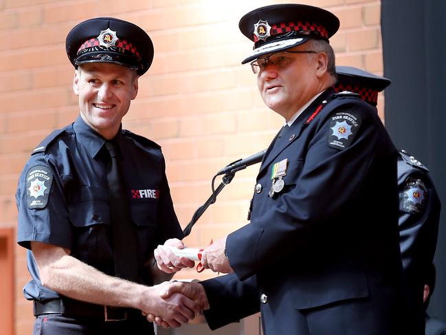 Kane Cornes with SAMFS Chief Fire Officer Greg Crossman as he graduates into the Metropolitan Fire Service. Picture: Mike Burton