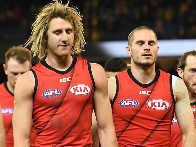 Dyson Heppell of the Bombers (third from left) leads his players from the field after the Round 22 AFL match between the Richmond Tigers and the Essendon Bombers at the MCG in Melbourne, Friday, August 17, 2018. (AAP Image/Julian Smith) NO ARCHIVING, EDITORIAL USE ONLY