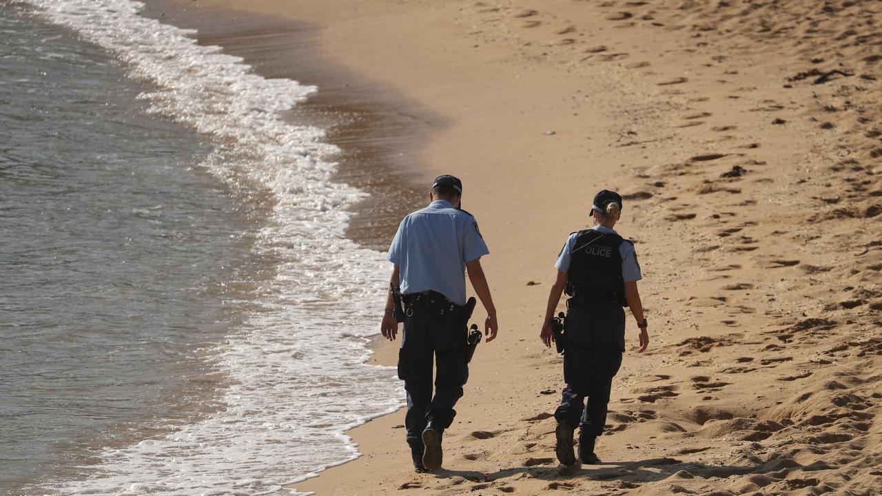 Police patrolling Little Bay on Friday. Picture: John Grainger