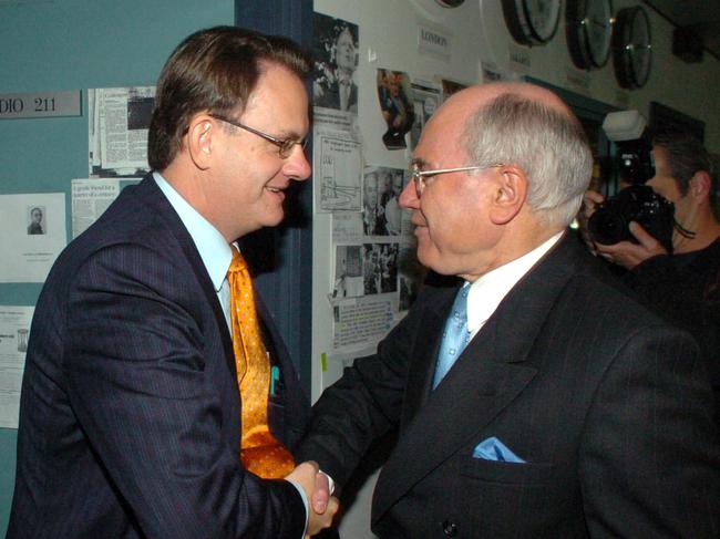 NEWS: Prime Minister John Howard (R) and Opposition Leader Mark Latham cross paths in the ABC radio studios in Sydney, during campaign for Federal election. Pic John Feder