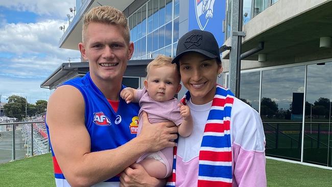 New Western Bulldog player Adam Treloar and wife Kim Ravallion and daughter Georgie at the home of the Western Bulldogs