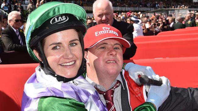 Michelle (left) and Steven Payne celebrate after Michelle rode Prince of Penzance to victory in the Melbourne Cup at Flemington Racecourse in Melbourne, Tuesday, Nov. 3, 2015. (AAP Image/Julian Smith) NO ARCHIVING, EDITORIAL USE ONLY