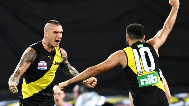 Edwards celebrates a goal with Dustin Martin. Picture: Quinn Rooney (Getty).