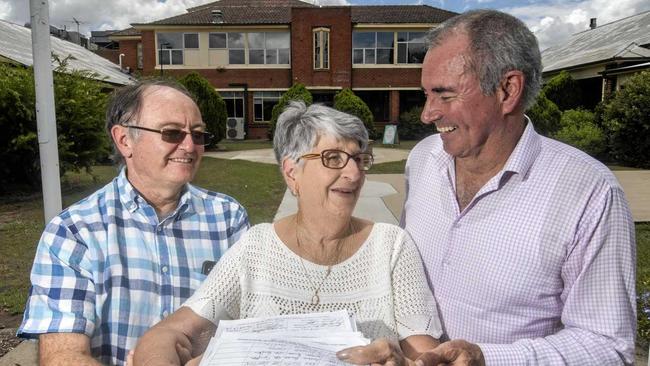 GOOD SIGN: North Coast Local Health District board member Dr Allan Tyson, long-time United Hospital Auxiliary member Alba Linklater and Member for Clarence Chris Gulaptis look over the thousands of signatures that helped make the Coalition commit $263 million towards the full redevelopment of Grafton Base Hospital at the announcement. Picture: Adam Hourigan