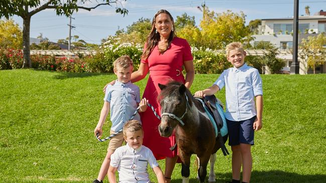 Olivia Anderson, pictured with her sons, says she misses watching her boys play sport. Picture: Dan Castano