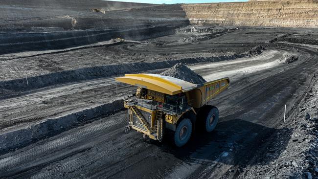 12 April 2022. Coal mining operations from Bravus (formerly known as Adani) at their Carmichael Coal Mine, Qld.A haul truck moving interburden to expose the next coal seam at the Carmichael minePIC: Cameron Laird