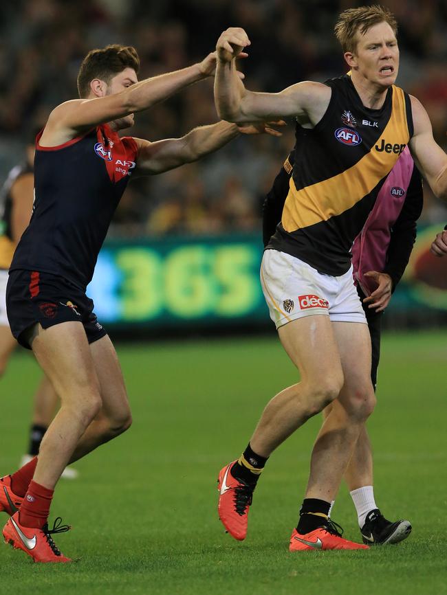 Jack Riewoldt shrugs off Tom Bugg as he leaves the field injured. Picture: Wayne Ludbey