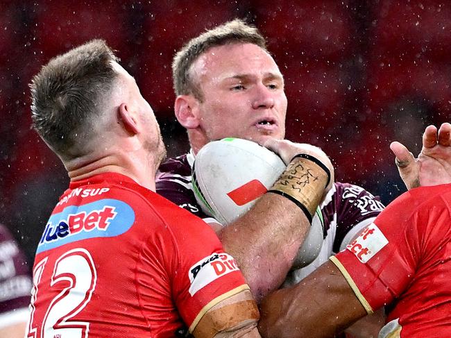 BRISBANE, AUSTRALIA - MAY 09: Matthew Lodge of the Sea Eagles takes on the defence during the round ten NRL match between the Dolphins and the Manly Sea Eagles at Kayo Stadium, on May 09, 2024, in Brisbane, Australia. (Photo by Bradley Kanaris/Getty Images)