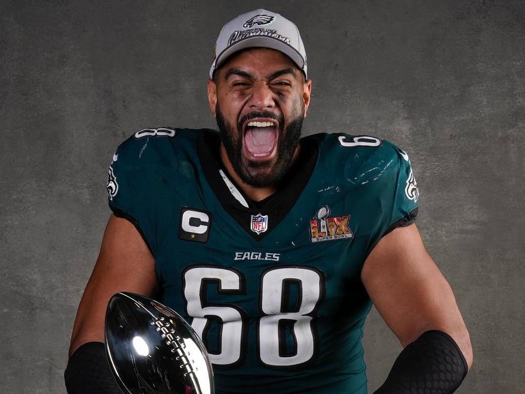 Jordan Mailata with the Vince Lombardi trophy celebrating the 2025 Super bowl win. Picture Ryan Kang