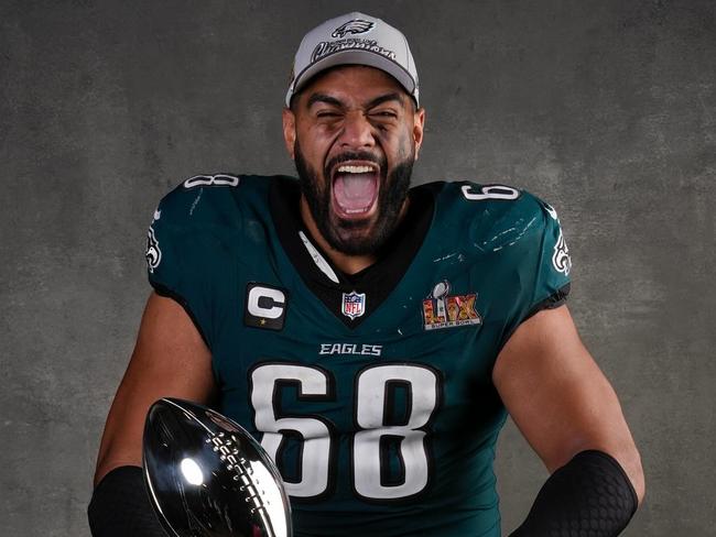 Jordan Mailata with the Vince Lombardi trophy celebrating the 2025 Super bowl win. Picture Ryan Kang