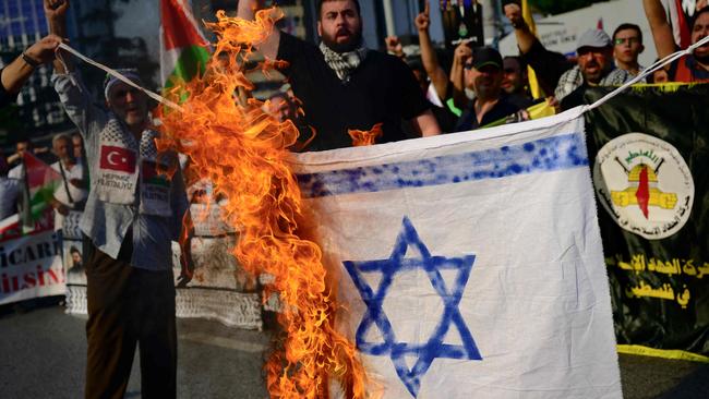 Demonstrators burn a homemade Israeli flag following the assassination of Lebanon's Hezbollah leader Sheikh Hassan Nasrallah. Picture: Yasin Akgul/AFP