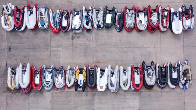 Dinghies believed to have been used by migrants picked up in the English Channel are stored in a Port Authority yard in Dover, southeast England. Picture: AFP