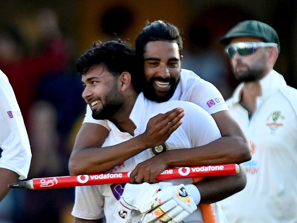 Rishabh Pant and Mohammed Siraj of India celebrate victory.