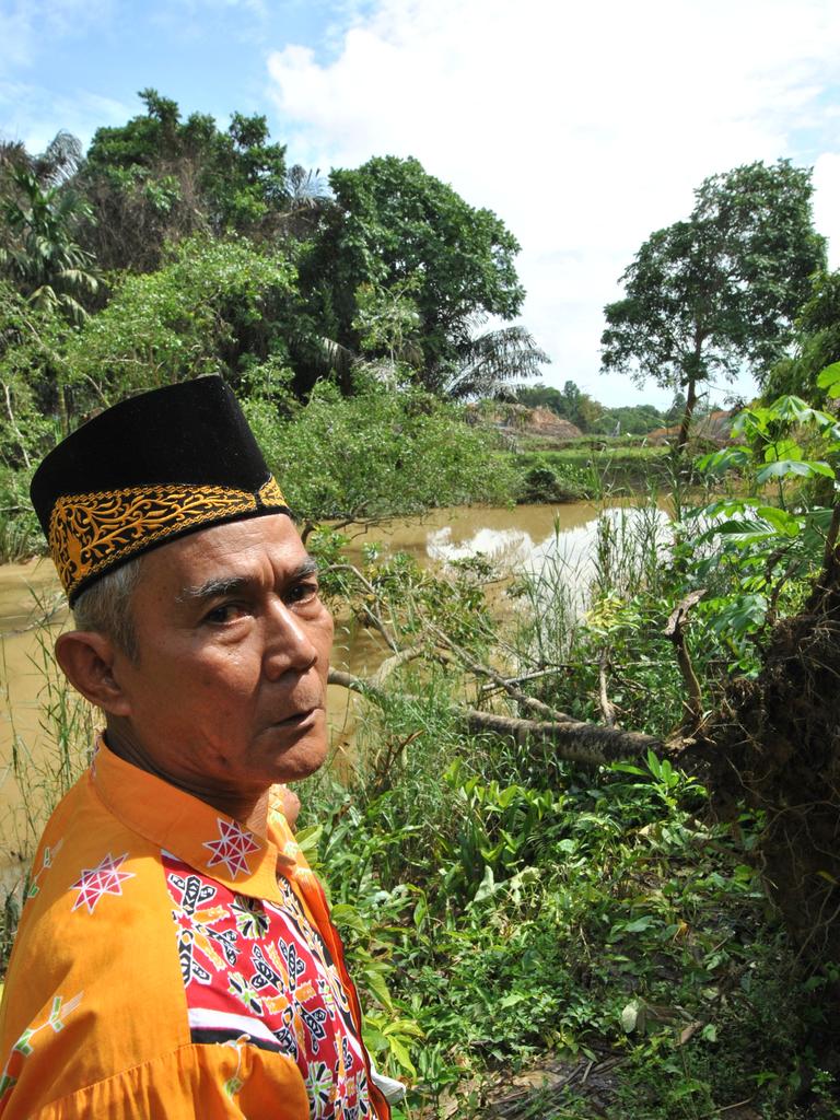 Balik tribal chief Sibukdin stand by the construction of a dike in Sepaku, close to the core development region of Indonesia’s new capital city in East Kalimantan.