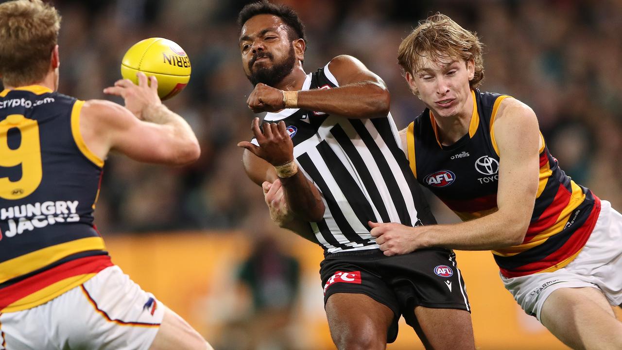 Max Michalanney tackles Junior Rioli on a night where the young Crow continued to shine.