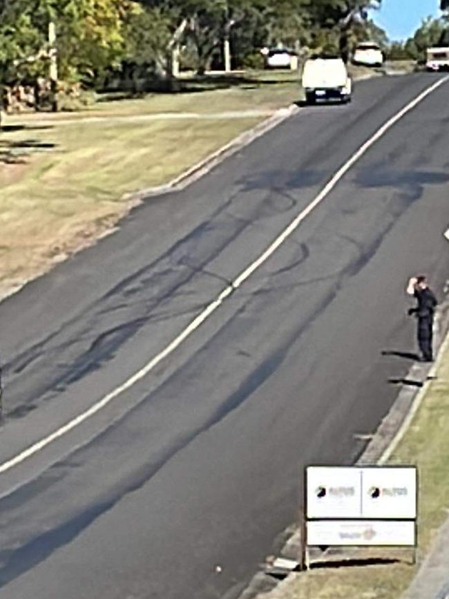 Police (right) at the scene on Tuesday. A man has been charged with attempted murder after an alleged hit and run on Sorensen Rd, Gympie.