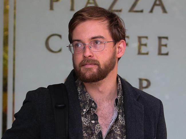 SYDNEY, AUSTRALIA : Newswire Photos - JANUARY 13 2025; Zack Schofield A climate activist is seen leaving the Downing Court in Sydney. The activist after he presented himself to Police after graffitiing the word Liar onto Tanya Pliberseks office. Picture: Newswire/ Gaye Gerard