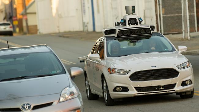 An Uber driverless Ford Fusion driving through central Pittsburgh last year. Picture: Jeff Swensen/Getty Images/AFP.