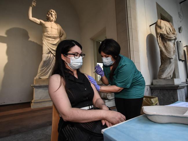 A health worker inoculates a woman with the Moderna vaccine. Picture: AFP