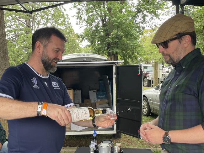 Craig from The Whiskey Company pouring some of his finest single malt whiskeys to a customer. Picture: Athos Sirianos