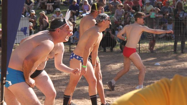 Competitors in the mens budgie smugglers race at the Henley on Todd in Alice Springs, Saturday, August 17, 2024. Picture: Gera Kazakov