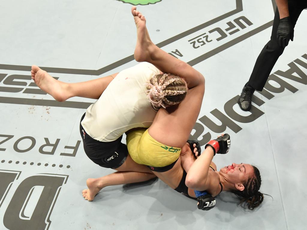 Amanda Ribas secures an armbar submission against Paige VanZant. (Photo by Jeff Bottari/Zuffa LLC via Getty Images)